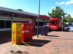 The Australia Post post office and an Australia Post van in Dickson, ACT