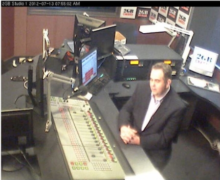 Andrew Moore in the 2GB Studios during a live cross to Seven's Sunrise program, as seen on the 2GB webcam. 13 July, 2012. Image credit: Macquarie Radio Network