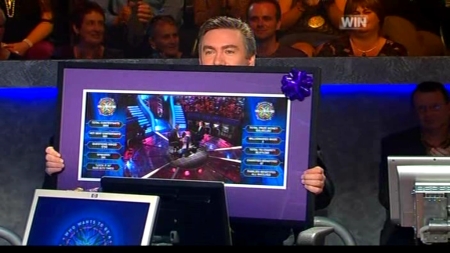 Eddie McGuire shows off the Who Wants To Be A Millionaire picture