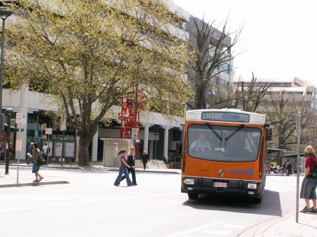 A nice orange ACTION bus