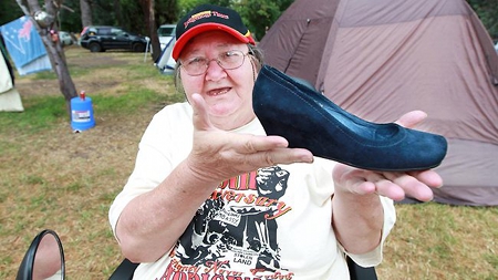 Pat Eatock holding Julia Gillard's stolen shoe. Picture h/t Gary Ramage of The Daily Telegraph