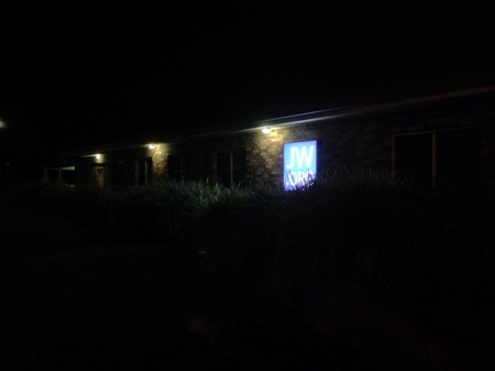 JW.org sign on Kingdom Hall in Dickson at night